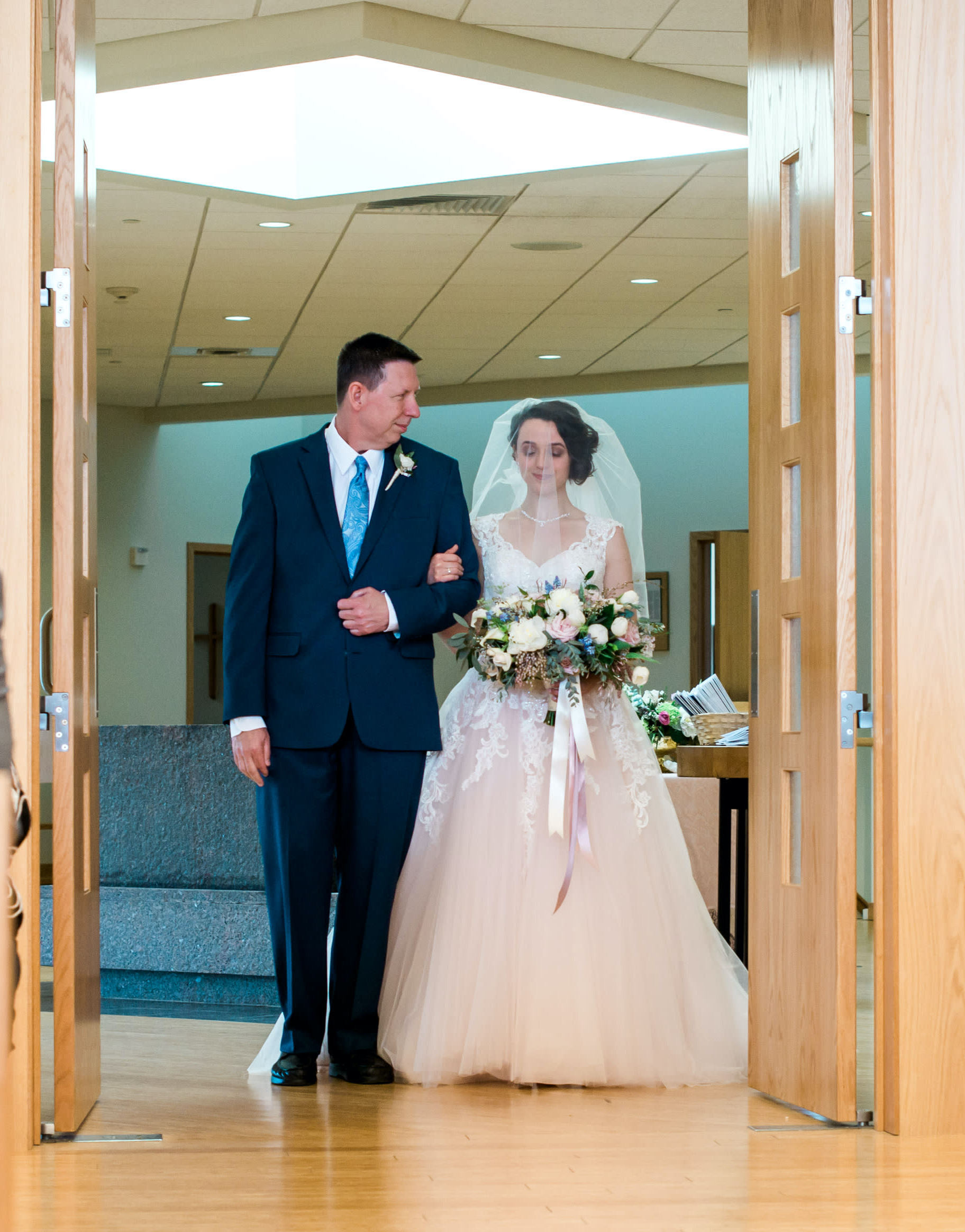 Dale walking Sarah down the aisle.